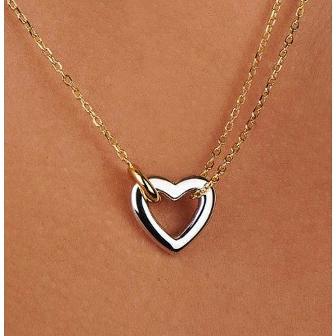 A close-up of a double-layered necklace worn on a person&