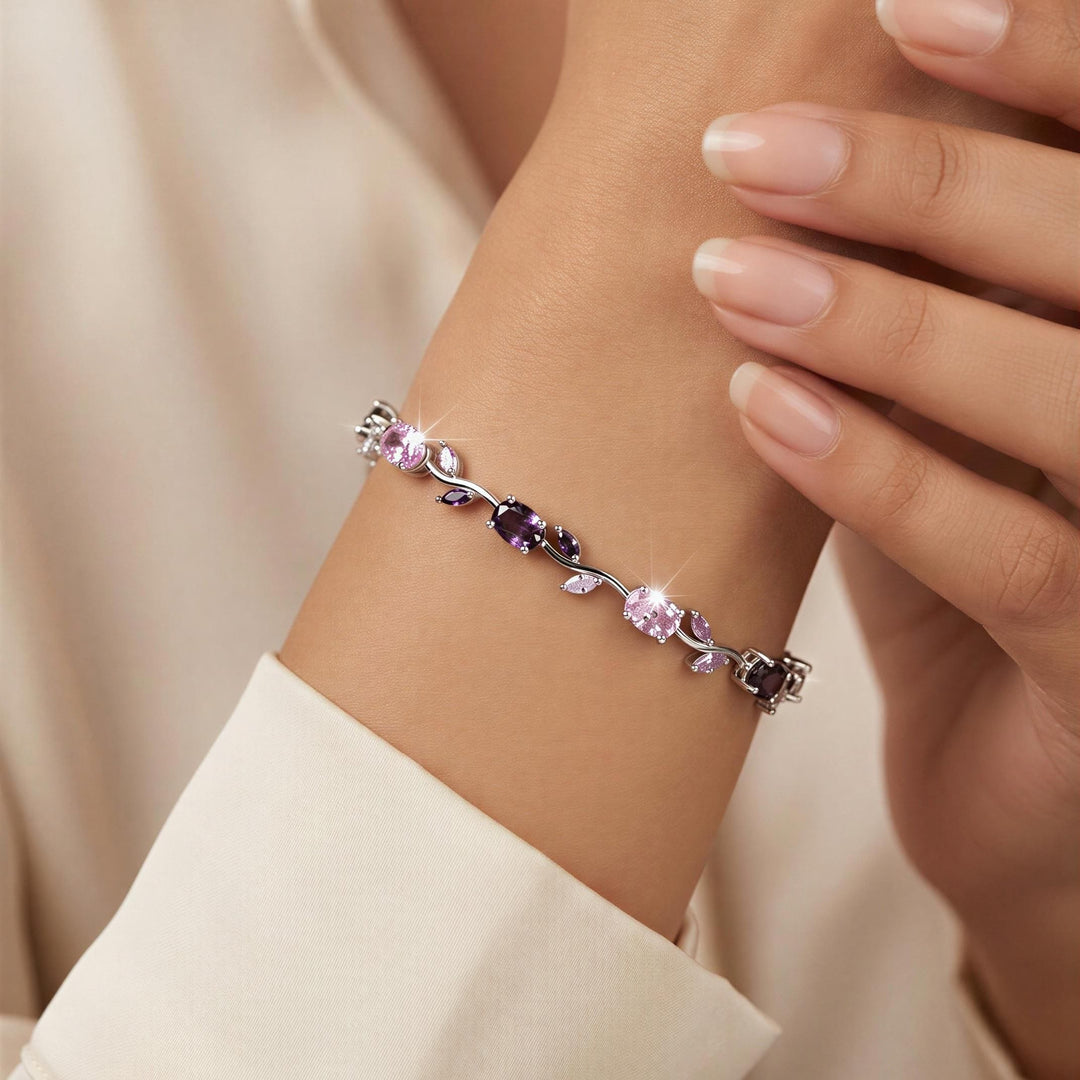 Tulip Bracelet with purple gemstones on a wrist against a light background