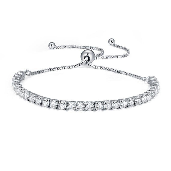 A silver-tone adjustable bracelet featuring a row of clear cubic zirconia stones across the front, displayed on a clean white background.
