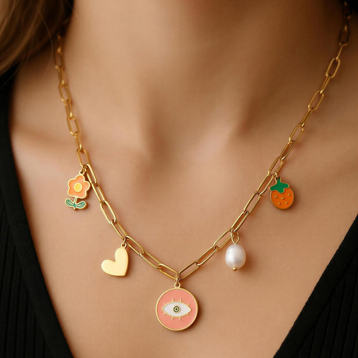 Necklace with various charms including a heart, eye, and flower on a black background