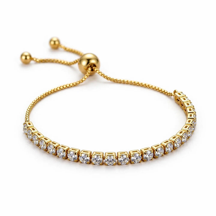 Gold bracelet with clear stones on a white background