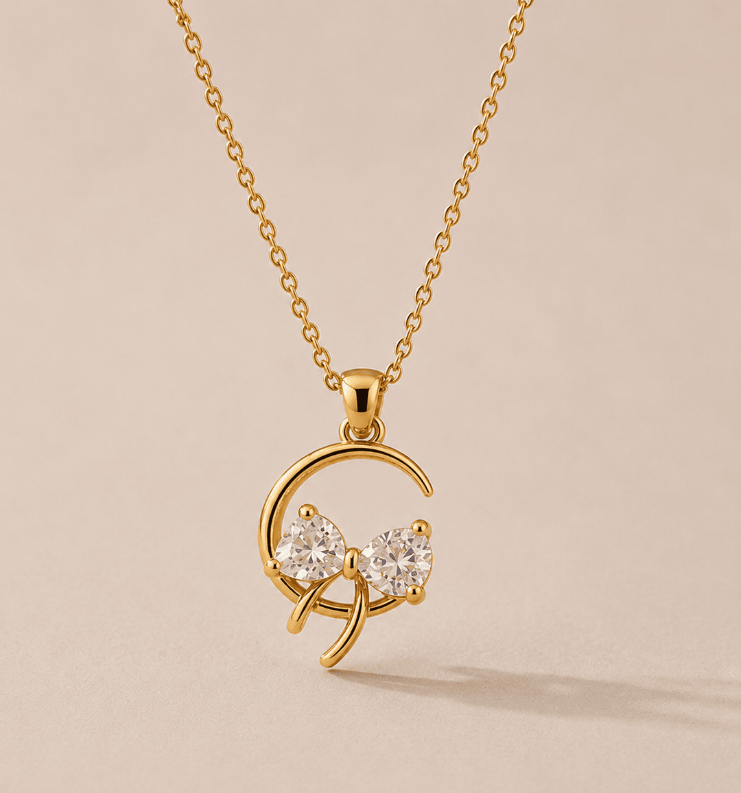 Gold necklace with a heart-shaped pendant on a beige background