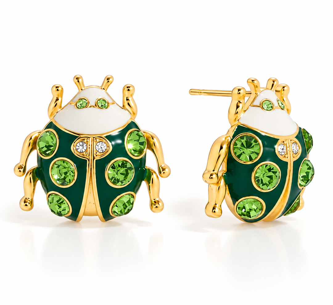 A pair of ladybug stud earrings with dark green enamel bodies, gold-plated legs and antennae, and green gemstone spots, shown from the front and side on a white background.