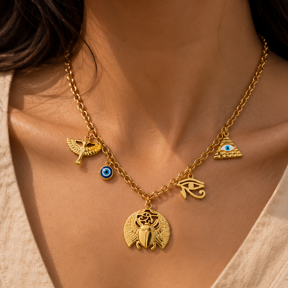 Gold necklace with charms on a person's neck