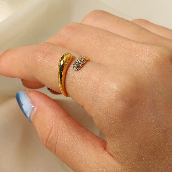 Gold ring with a diamond on a person&