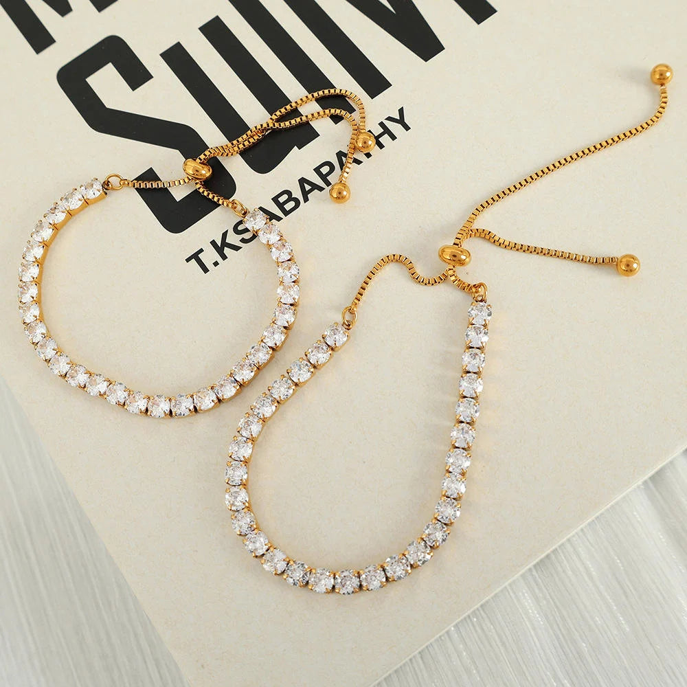 Gold and crystal bracelet on a brand name card