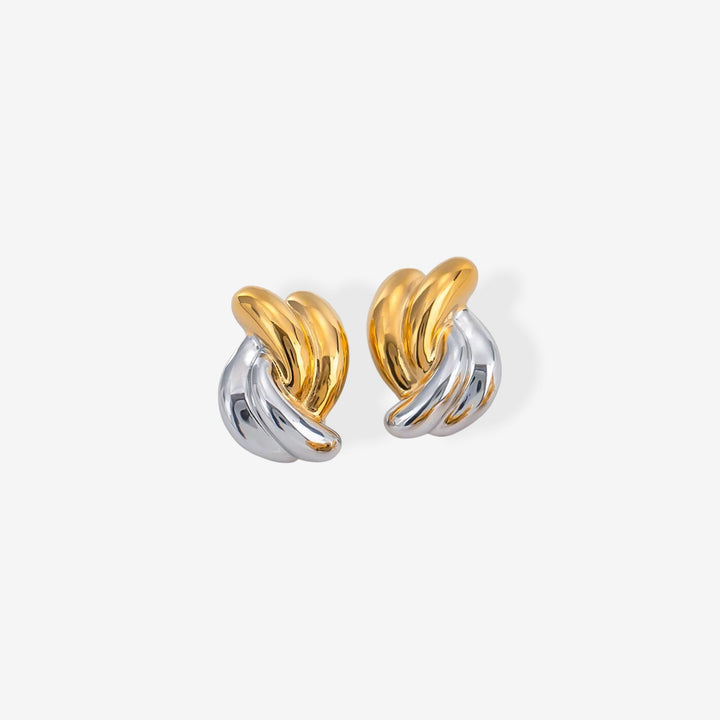 A pair of two-tone twisted knot hoop earrings in polished gold and silver, displayed on a clean, light gray background.