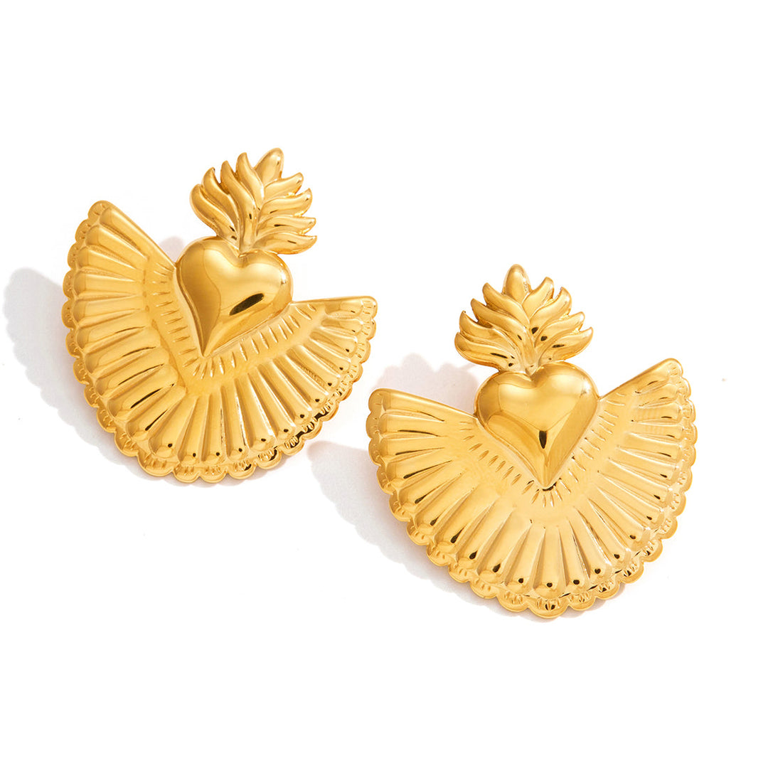 Gold heart-shaped earrings with wing-like designs on a white background