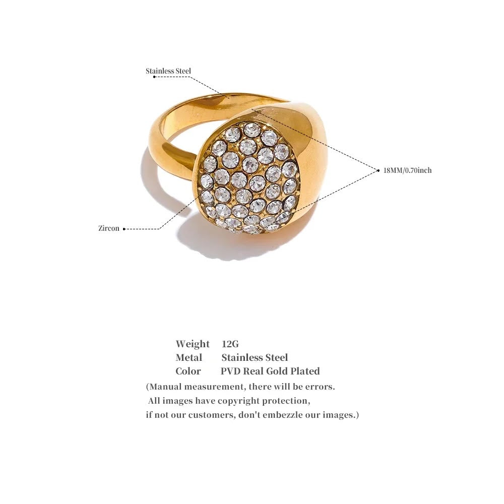 Gold ring with zirconia stones on a white background