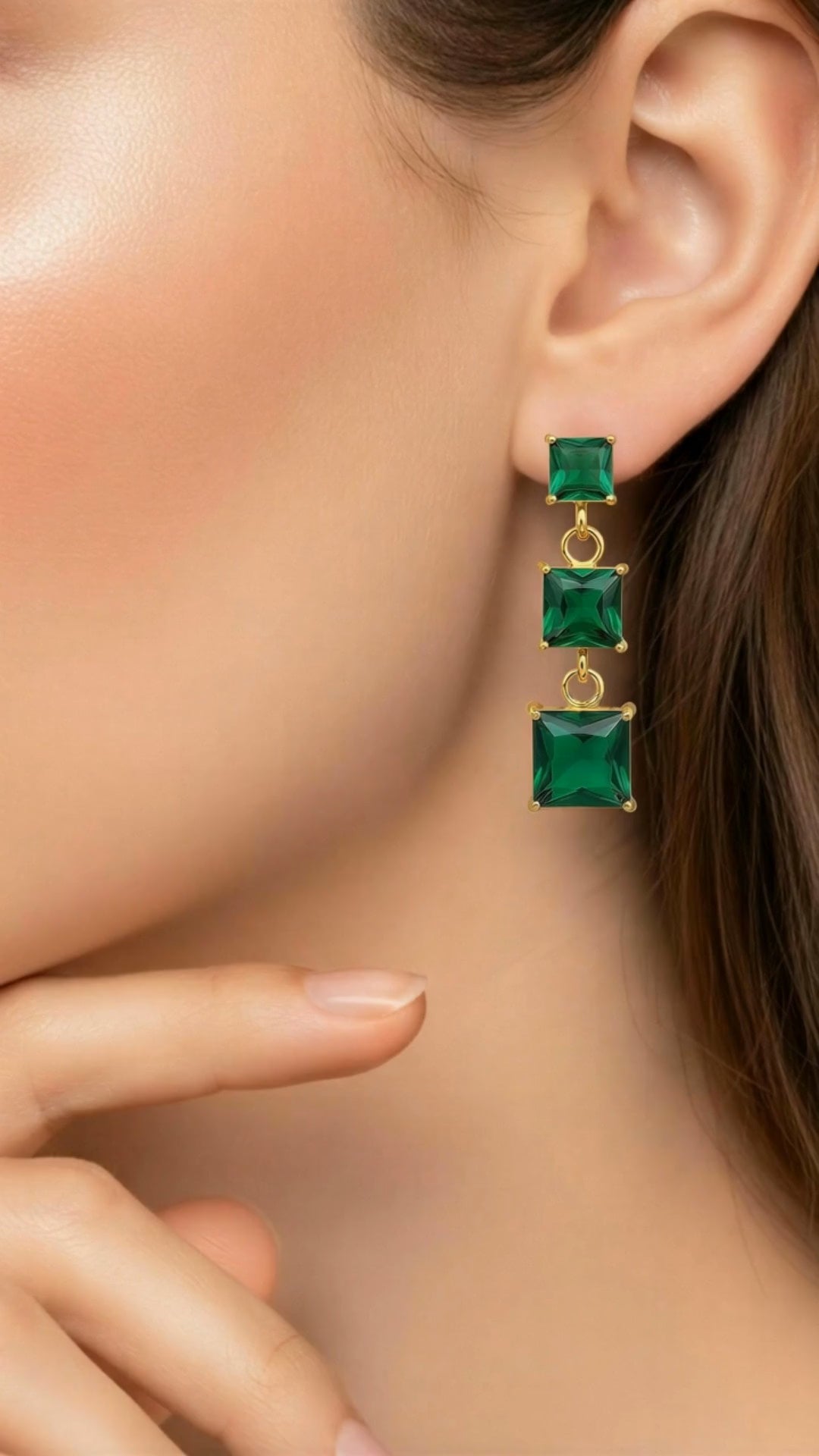 closeup video for the green emerald gem earrings 
