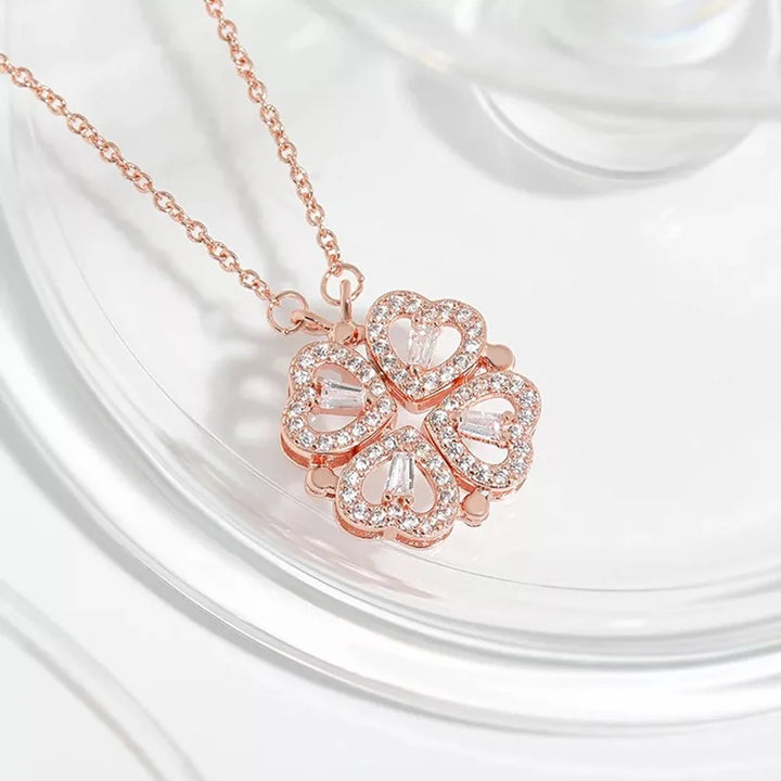 Rose gold necklace with a heart-shaped pendant on a white background